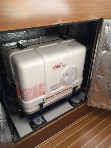 Slide: The Image of Generator compartment in a 2026 Catalina 426 yacht, featuring a Fischer Panda 6500 generator. - 40