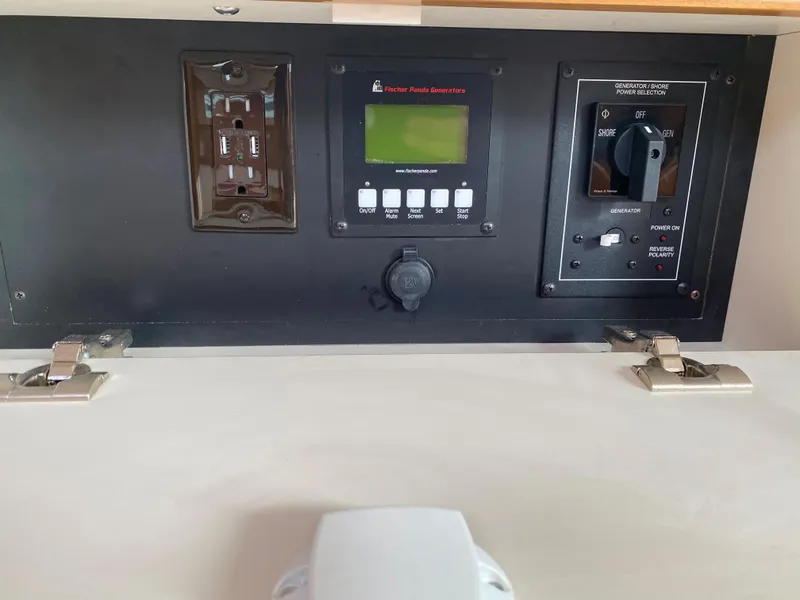 Slide: The Image of Control panel of a 2026 Catalina 426 boat with digital display and switches. - 41