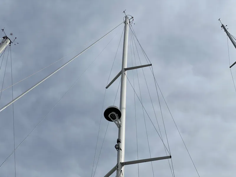 Slide: The Image of Mast of a 2026 Catalina 426 sailboat against a cloudy sky. - 49