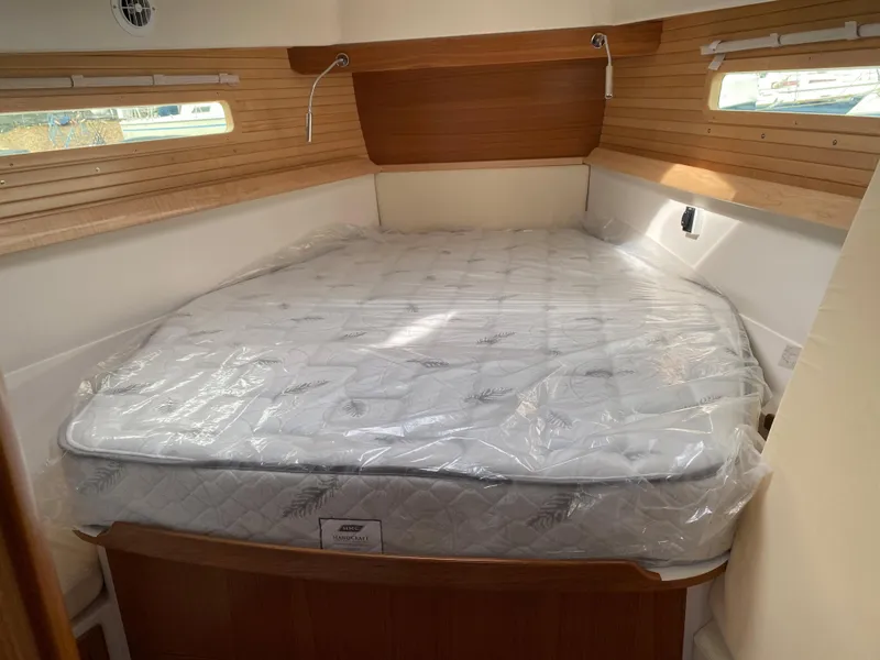 Slide: The Image of Cozy cabin interior of 2026 Catalina 426 yacht with a neatly made bed. - 6