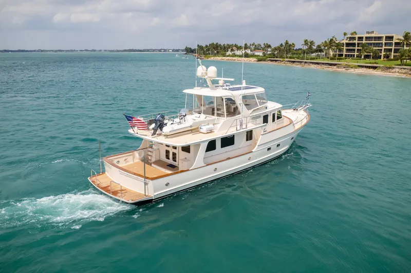 Slide: The Image of Luxury Fleming 65 yacht cruising in clear blue waters, 2027 model. - 5