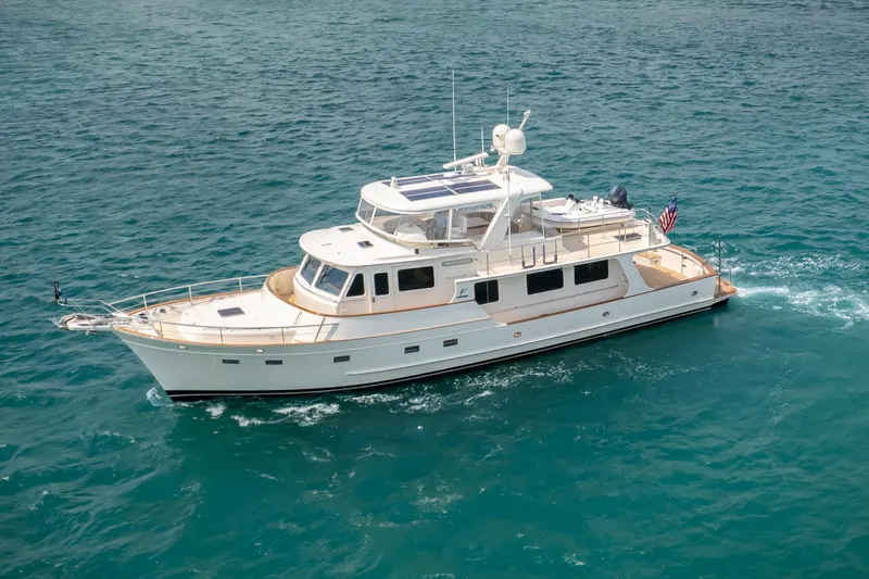 Slide: The Image of Luxurious 2027 Fleming 65 yacht cruising on clear blue waters. - 7