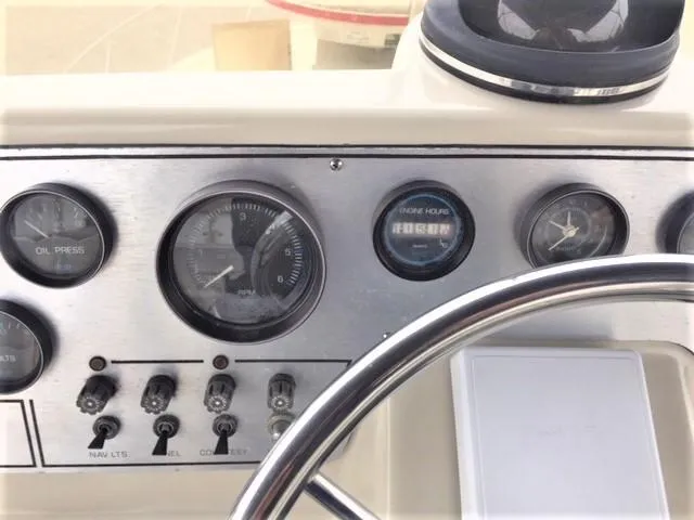 Slide: The Image of 1986 Silverton 40 Double Cabin dashboard with gauges and controls. - 7