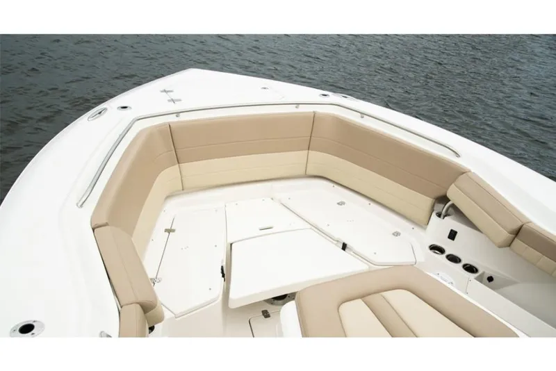 Slide: The Image of 2023 Sailfish 360 CC boat with spacious seating area and water view. - 13
