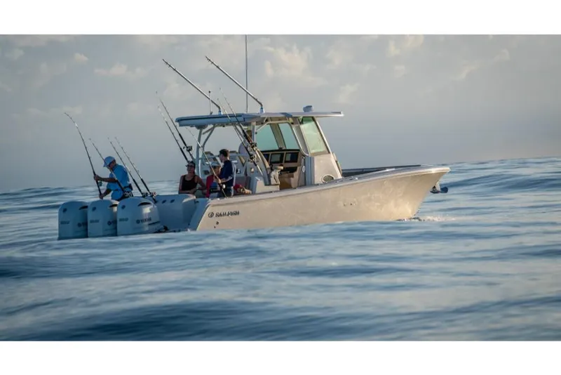 Slide: The Image of 2023 Sailfish 360 CC boat with anglers fishing in open water. - 26
