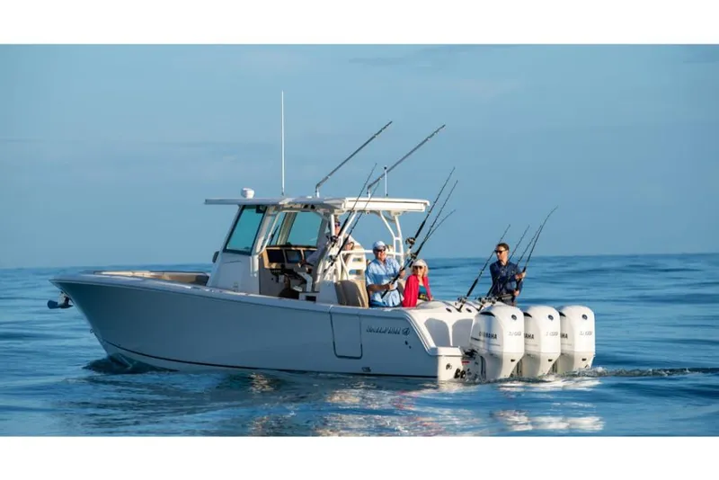 Slide: The Image of 2023 Sailfish 360 CC boat with multiple people fishing in open water. - 27