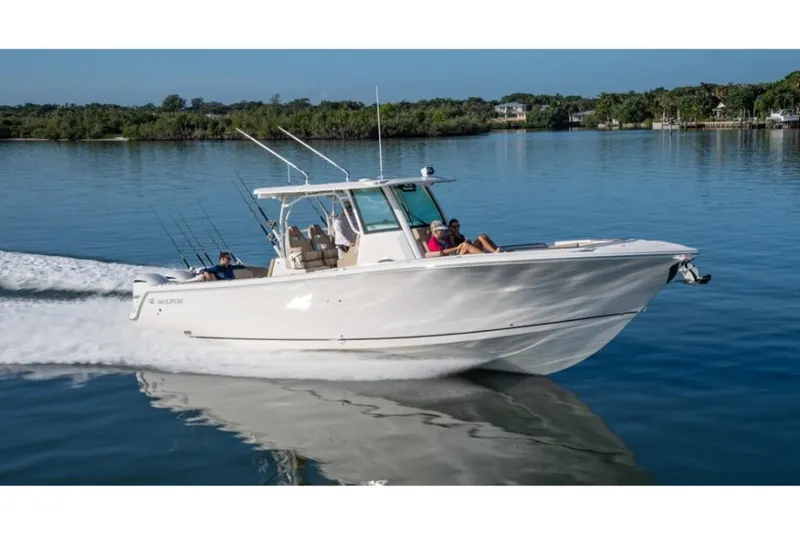 Slide: The Image of 2023 Sailfish 360 CC boat cruising on a calm lake. - 28