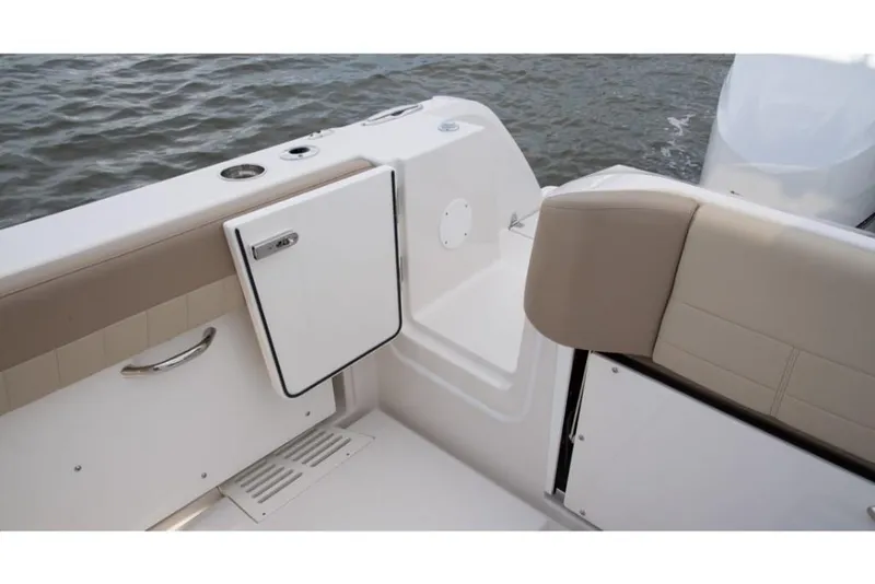 Slide: The Image of 2023 Sailfish 360 CC boat interior, featuring seating and storage compartments. - 30