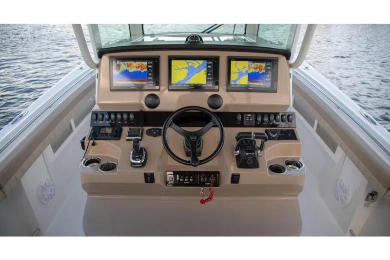 Slide: The Image of 2023 Sailfish 360 CC boat helm with advanced navigation displays. - 35