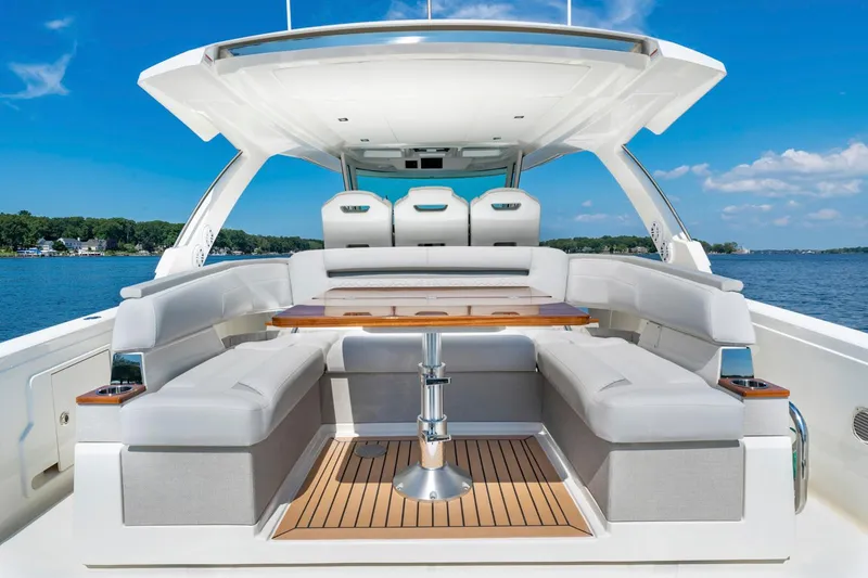 Slide: The Image of 2025 Tiara Sport 38 LS luxury yacht interior with spacious seating and table. - 11