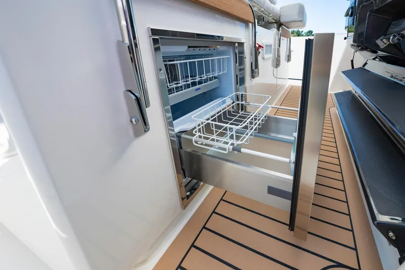 Slide: The Image of Open drawer refrigerator on 2025 Tiara Sport 38 LS boat. - 14