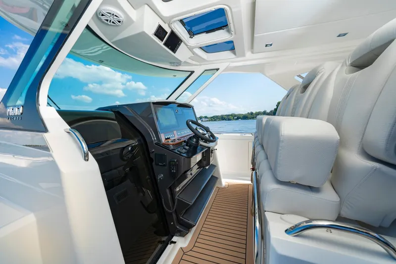 Slide: The Image of 2025 Tiara Sport 38 LS boat interior with modern helm and luxurious seating - 16