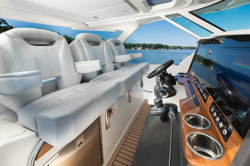 Slide: The Image of 2025 Tiara Sport 38 LS luxury boat interior with modern seating and advanced navigation system. - 17
