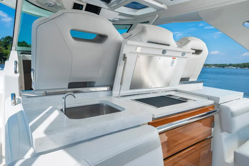 Slide: The Image of 2025 Tiara Sport 38 LS yacht with outdoor kitchen and sink. - 24