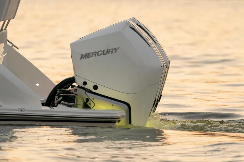 Slide: The Image of 2025 Tiara Sport 38 LS with Mercury outboard engine in water. - 28