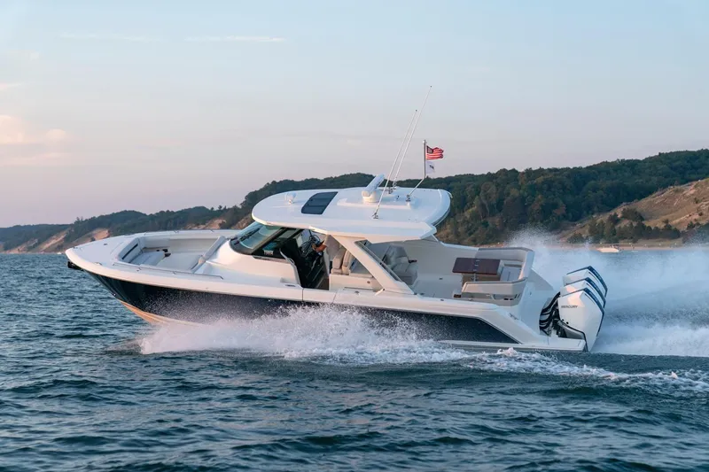 Slide: The Image of 2025 Tiara Sport 38 LS boat cruising on open water. - 7