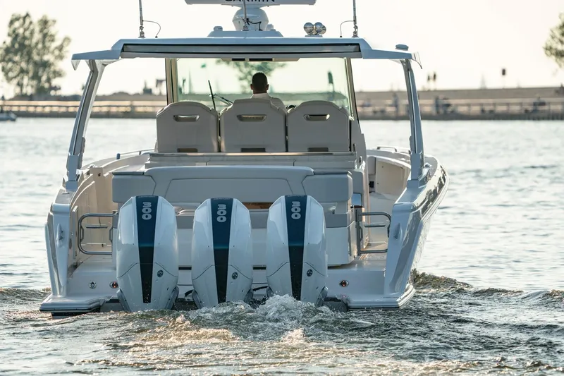 Slide: The Image of 2025 Tiara Sport 38 LS boat with triple outboard engines on the water. - 8