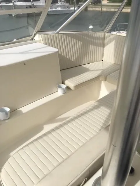 Slide: The Image of 2001 Ocean Yachts 56 Super Sport boat interior seating area. - 2