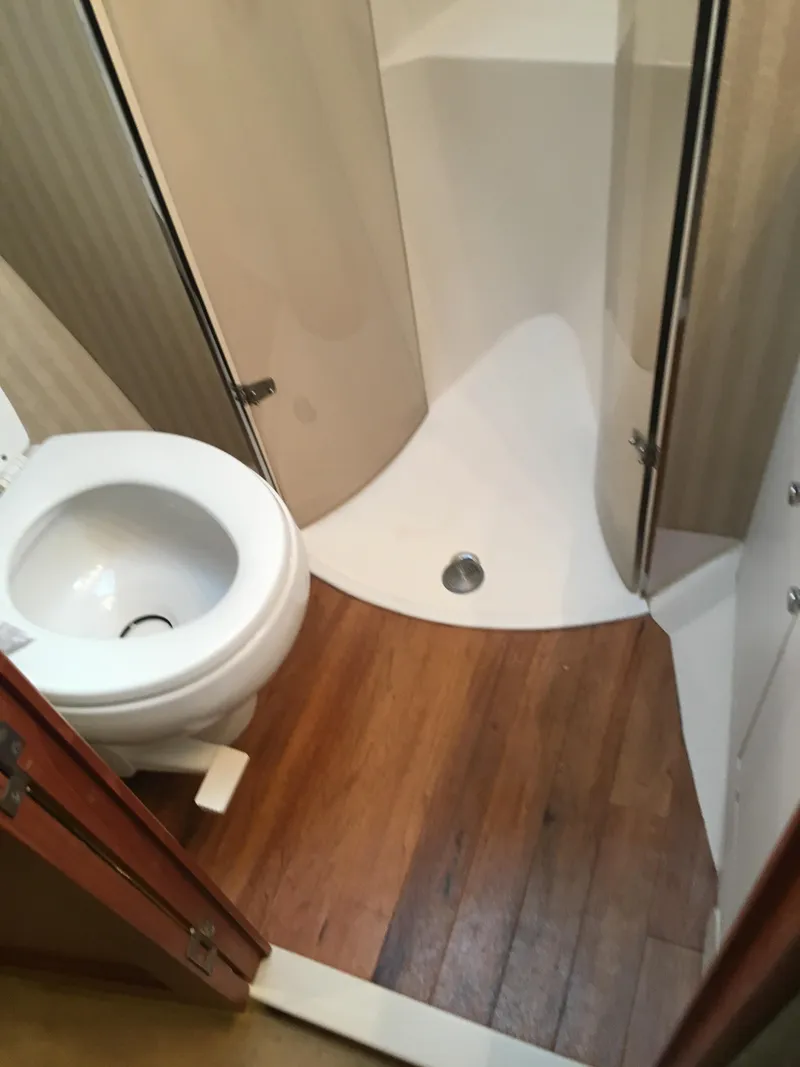 Slide: The Image of Bathroom interior of a 2001 Ocean Yachts 56 Super Sport with wooden flooring. - 24