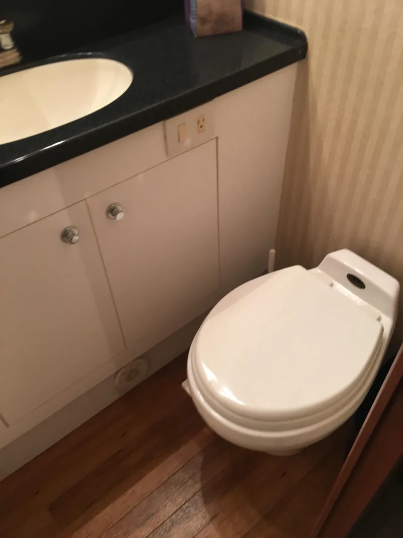 Slide: The Image of Bathroom in 2001 Ocean Yachts 56 Super Sport with sink and toilet. - 27