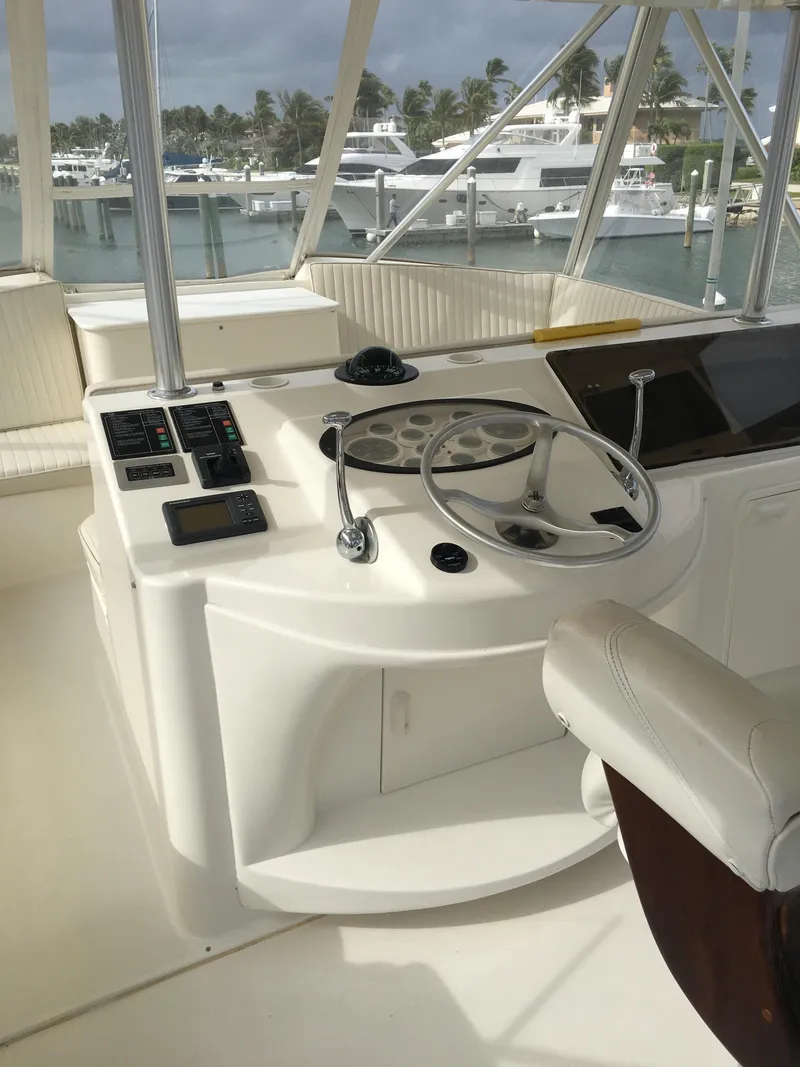 Slide: The Image of Helm of 2001 Ocean Yachts 56 Super Sport with marina view. - 7
