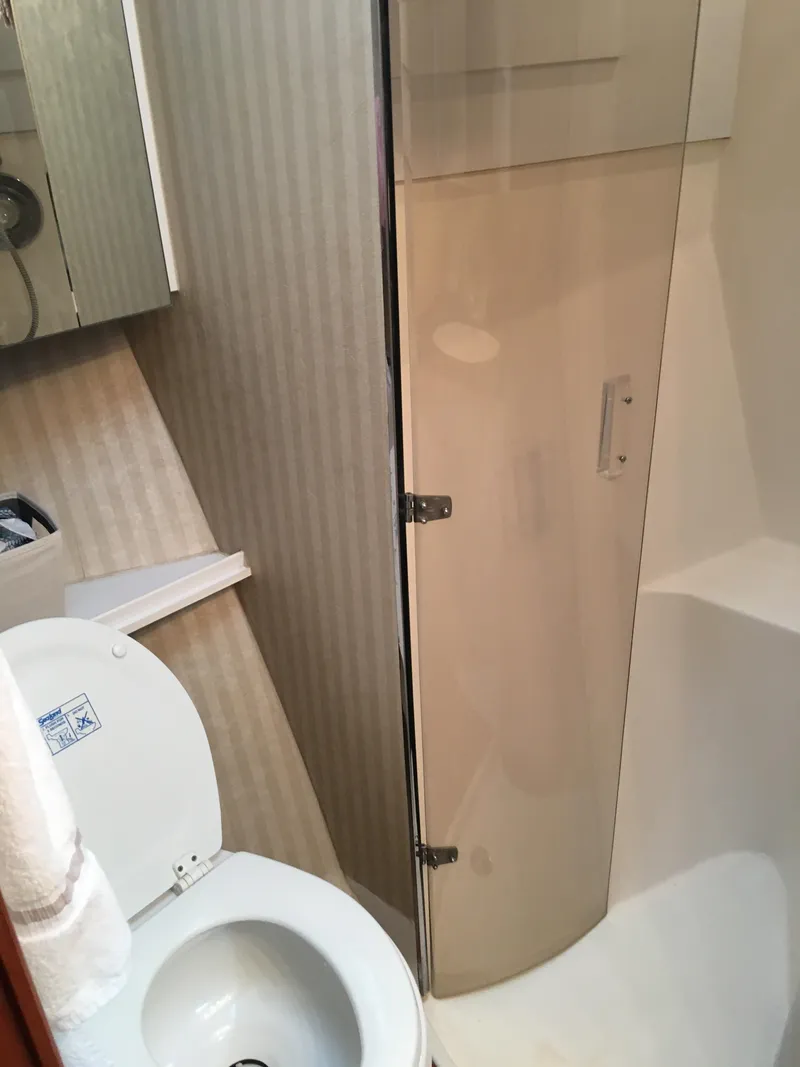 Slide: The Image of Bathroom interior of 2001 Ocean Yachts 56 Super Sport with shower and toilet. - 25