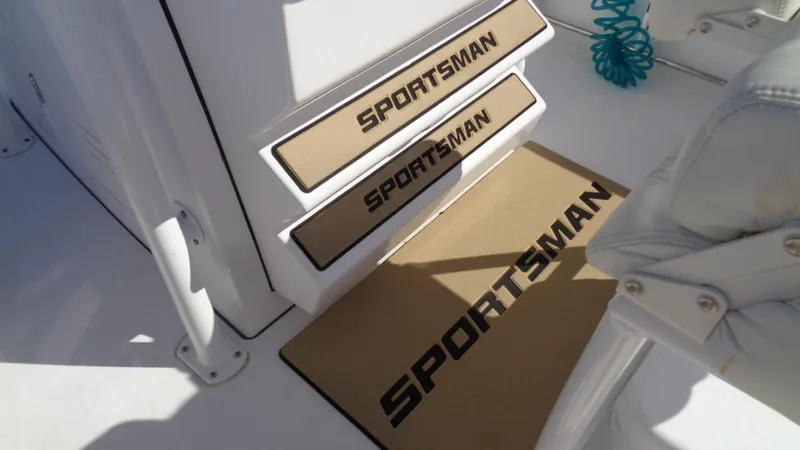 Slide: The Image of 2018 Sportsman 242 Open boat interior with branded steps and mat. - 10