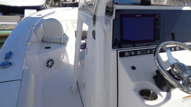 Slide: The Image of 2018 Sportsman 242 Open boat interior with steering console and seating area. - 11