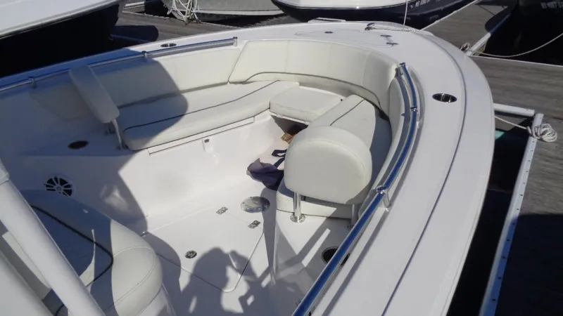 Slide: The Image of 2018 Sportsman 242 Open boat interior with white seating and stainless steel railings. - 7