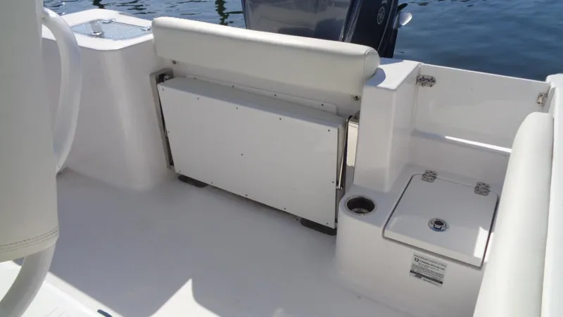 Slide: The Image of 2018 Sportsman 242 Open boat interior with seating and storage compartments. - 9