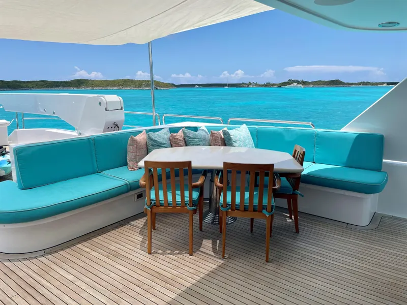 Slide: The Image of Luxurious outdoor area on 2006 Westport Tri-Deck Motoryacht with turquoise seating. - 14
