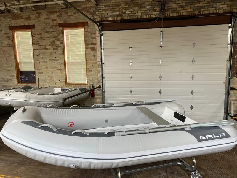 Slide: The Image of 2023 Gala A300 Ultra Lite inflatable boat in a garage. - 1