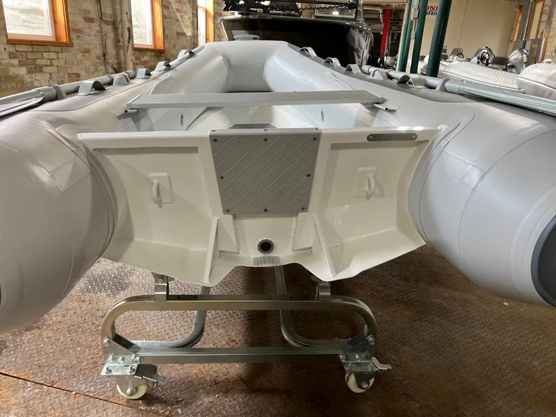 Slide: The Image of 2023 Gala A300 Ultra Lite inflatable boat on a metal stand indoors. - 5