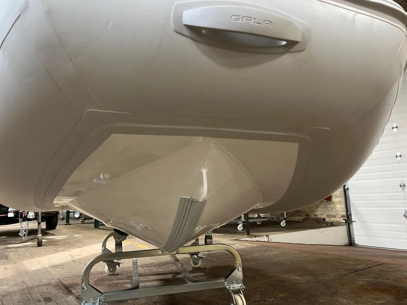 Slide: The Image of 2023 Gala A300 Ultra Lite boat hull on a trailer in a garage. - 6