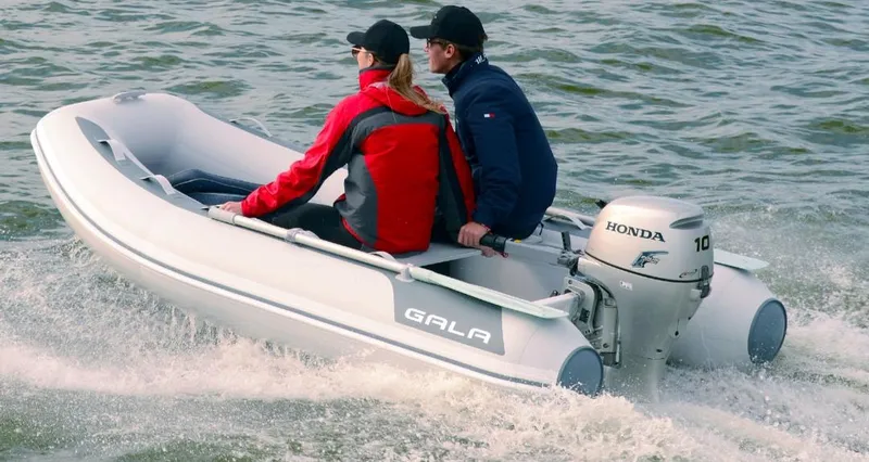 Slide: The Image of Two people riding a 2023 Gala A300 ultra lite inflatable boat on water. - 8