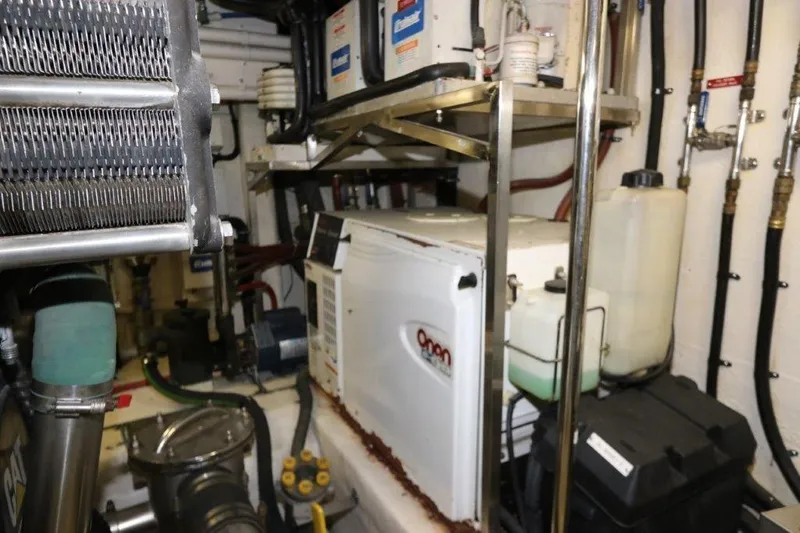 Slide: The Image of Engine room of 2004 Riviera 58 Enclosed Flybridge with Onan generator. - 31