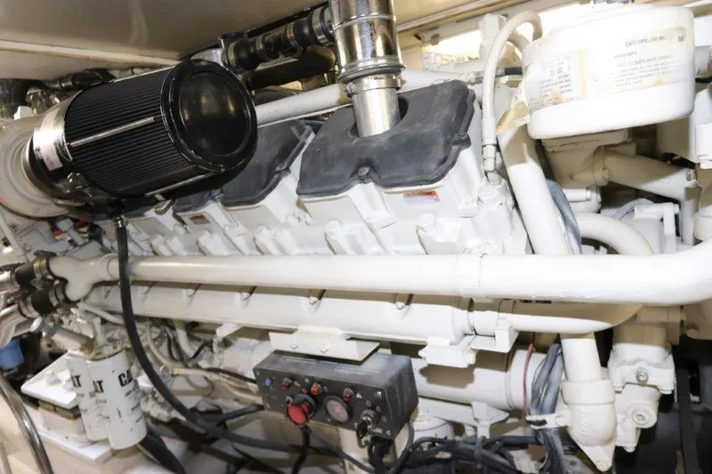 Slide: The Image of Engine room of a 2004 Riviera 58 Enclosed Flybridge yacht. - 35