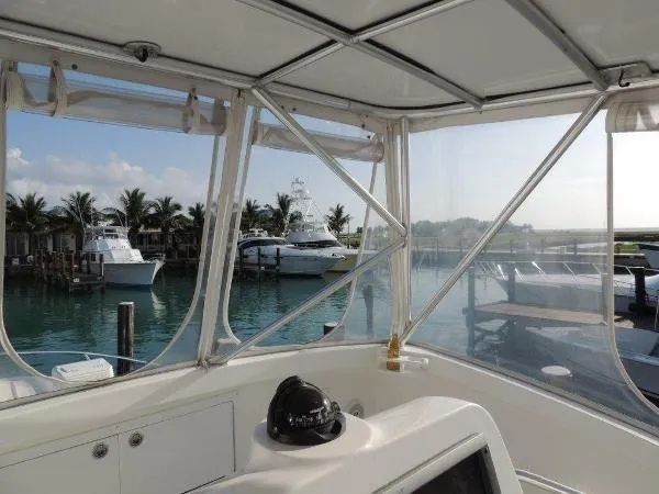 Slide: The Image of View from the cockpit of a 2008 Luhrs 35C yacht docked at a marina. - 13