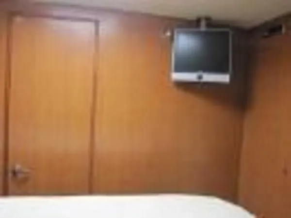 Slide: The Image of 2008 Luhrs 35C cabin interior with mounted TV. - 21