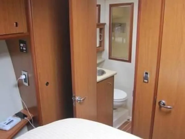 Slide: The Image of 2008 Luhrs 35C yacht interior with bathroom and wooden cabinetry. - 23