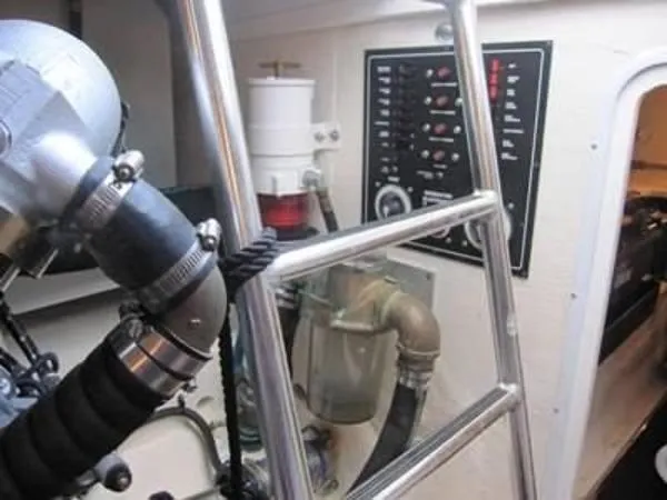Slide: The Image of Engine room of a 2008 Luhrs 35C boat with control panel and piping. - 29