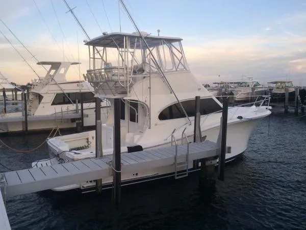 Slide: The Image of 2008 Luhrs 35C yacht docked at marina during sunset. - 4
