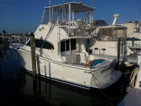 Slide: The Image of 2008 Luhrs 35C yacht docked at marina, side view. - 5