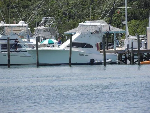 Slide: The Image of 2008 Luhrs 35C yacht docked at a marina with other boats. - 7