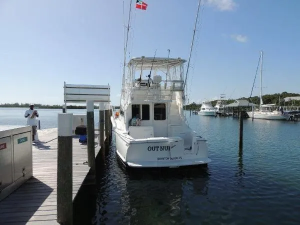 Slide: The Image of 2008 Luhrs 35C boat docked at a marina on a sunny day. - 8