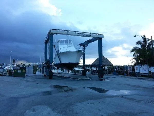 Slide: The Image of 2008 Luhrs 35C boat on a lift at a marina. - 9