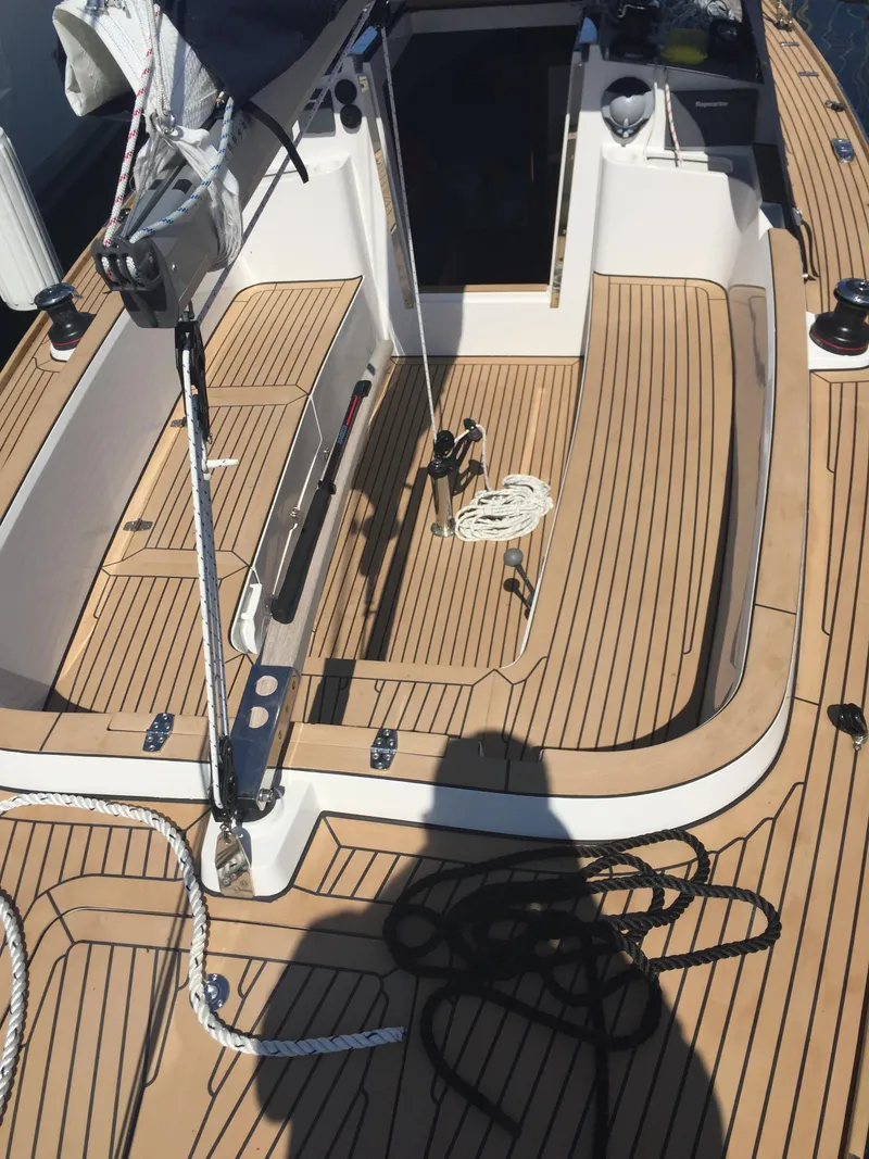 Slide: The Image of 2025 Saffier SC 8M Cabin sailboat deck with teak finish and rigging details. - 2
