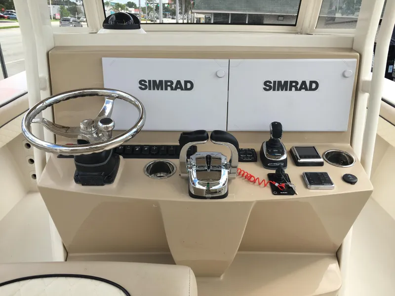 Slide: The Image of Helm of 2026 Sea Chaser 35 HFC with dual Simrad displays and controls. - 17
