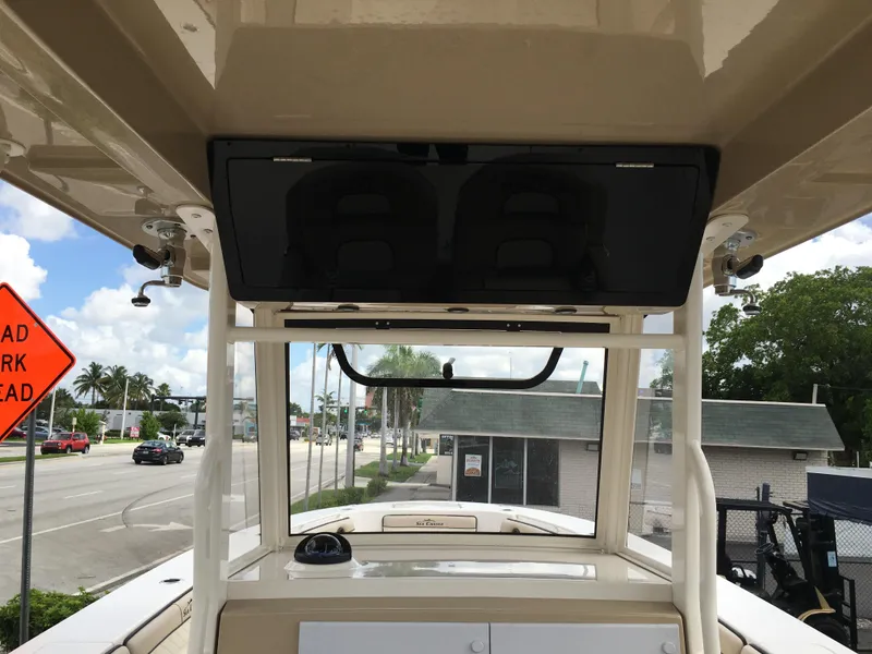 Slide: The Image of 2026 Sea Chaser 35 HFC boat interior with overhead console and street view. - 18