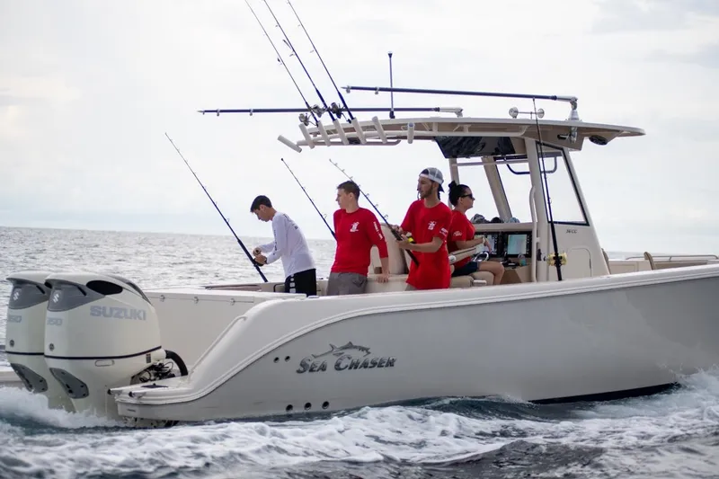 Slide: The Image of 2026 Sea Chaser 35 HFC boat with anglers fishing in open water. - 2